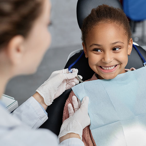 Young Girl Receiving a Dental Exam